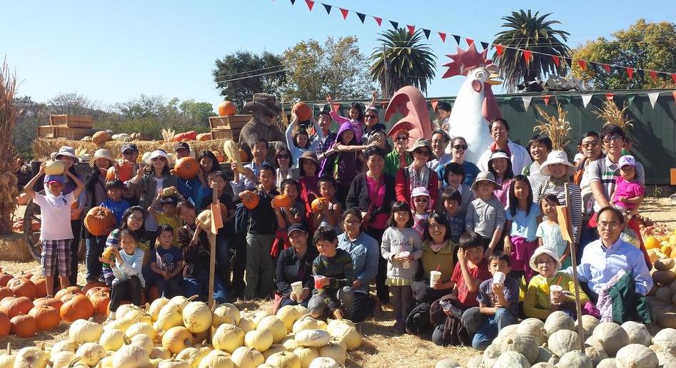 Group photo of visiting scholars at Pumpkin Patch
