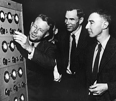 Men looking at circuit board