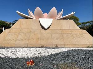 Author image of Cijin Memorial Park for Women Laborers, with an anonymous offering of fruit in the foreground. 